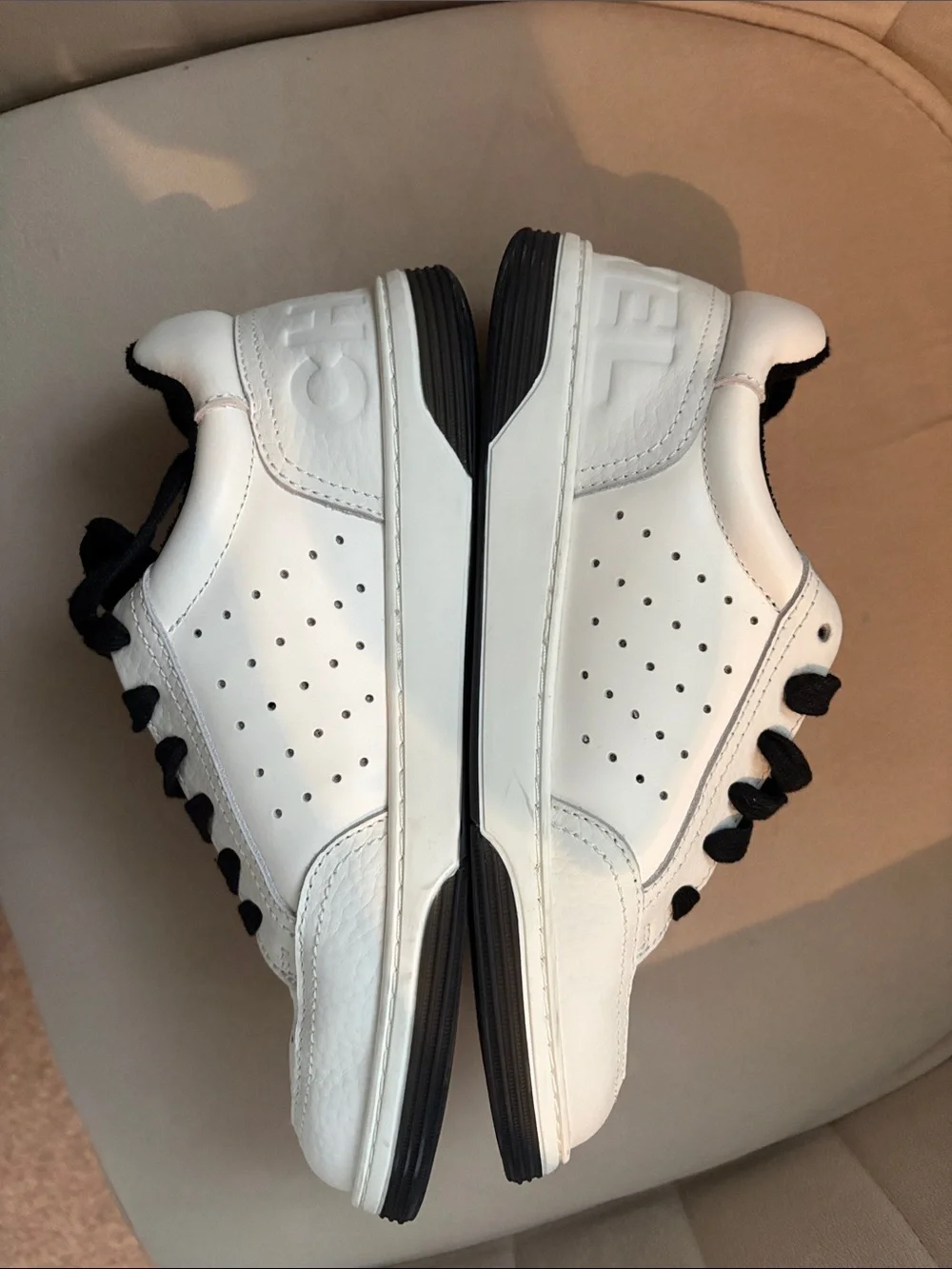 CHANEL White Leather Sneakers with Black Accents